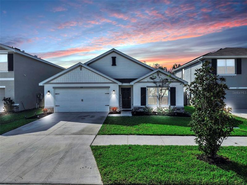 Front exterior of a new home in Berry Bay, Wimauma, FL, highlighting curb appeal (Image 20). Front exterior of a new home in Berry Bay, Wimauma, FL, highlighting curb appeal (Image 20).