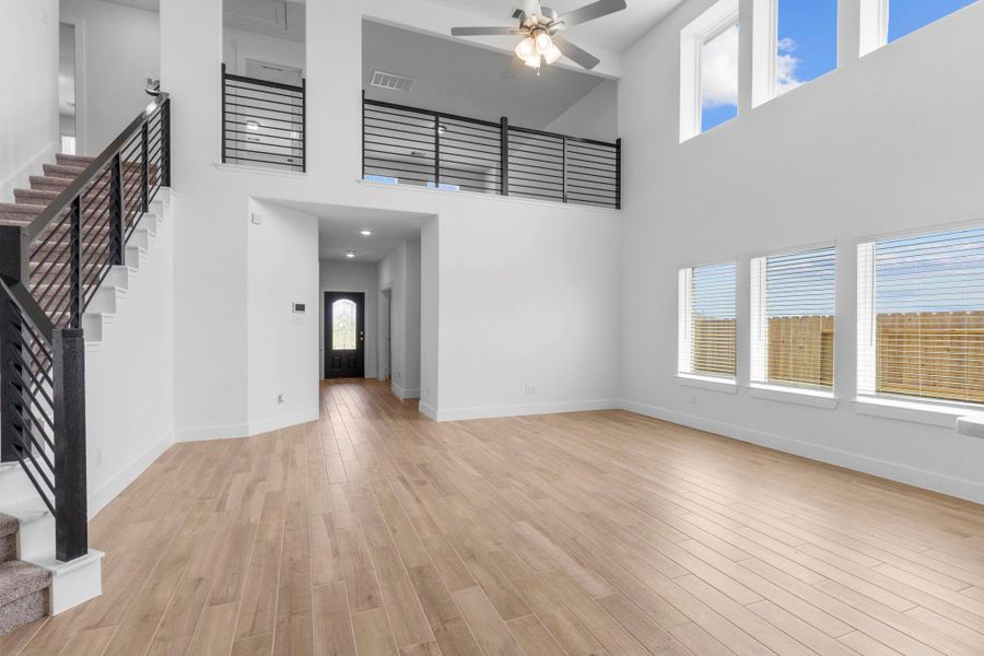 Incredible 2-story wall of windows in the family area, providing picturesque backyard views — call now to make this dream home yours! Incredible 2-story wall of windows in the family area, providing picturesque backyard views — call now to make this dream home yours!