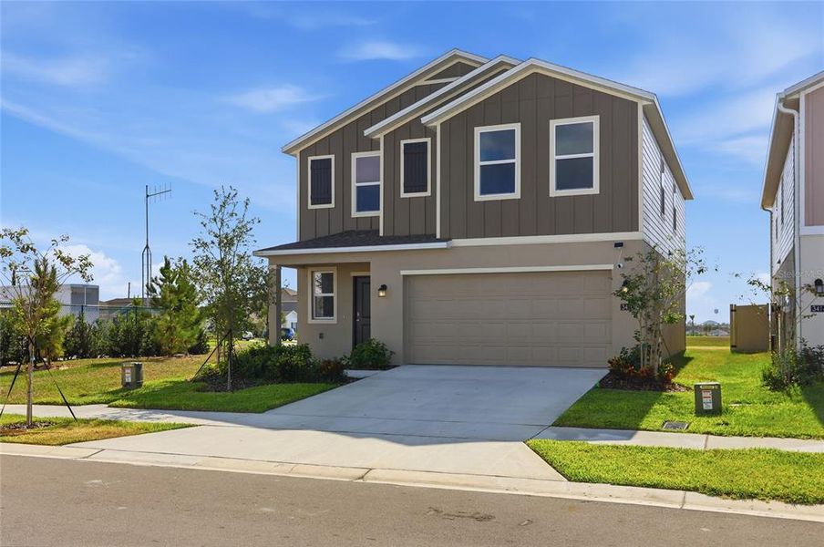 Front exterior of a new home in , Lake Wales, FL, highlighting curb appeal (Image 26). Front exterior of a new home in , Lake Wales, FL, highlighting curb appeal (Image 26).