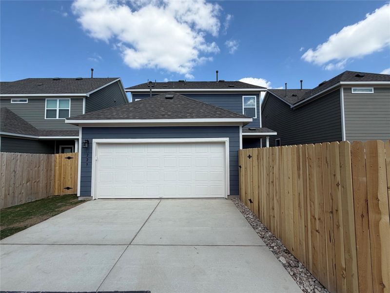 Front exterior of a new home in Lariat, Liberty Hill, TX, highlighting curb appeal (Image 20).