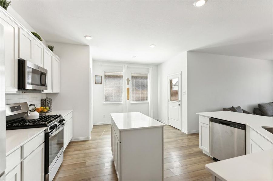 Kitchen and large island has ample space for all your cooking needs.