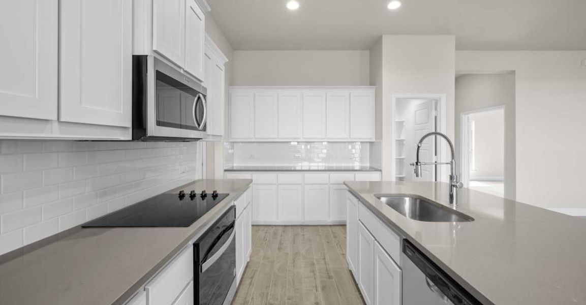 Representative exterior photo of a completed home built from the Alderbury by Impression Homes in Timberbrook, Justin, TX (Image 7).