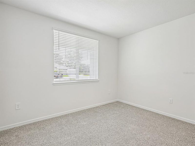 Spacious, unfurnished interior of a new home in The Grove at Stuart Crossing - Signature Series, Bartow (Image 11).
