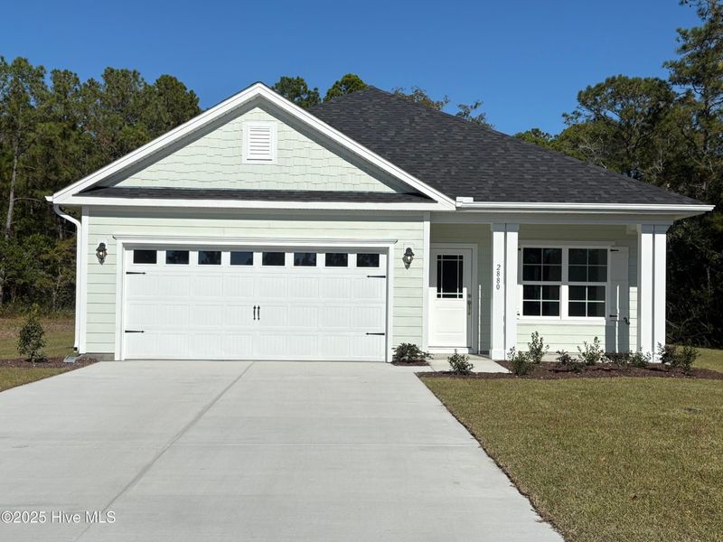 Front exterior of a new home in Rutledge, Shallotte, NC, highlighting curb appeal (Image 1). Front exterior of a new home in Rutledge, Shallotte, NC, highlighting curb appeal (Image 1).