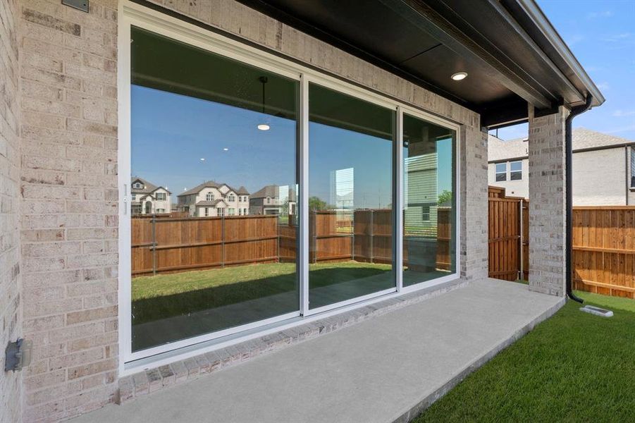Exterior details and patio area of a home in Villages of Creekwood, Frisco (Image 3).