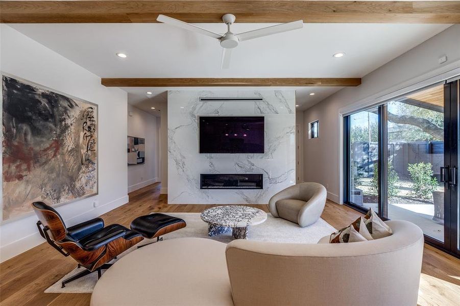 Living Room with beamed ceiling,  premium fireplace, 9" white oak floors