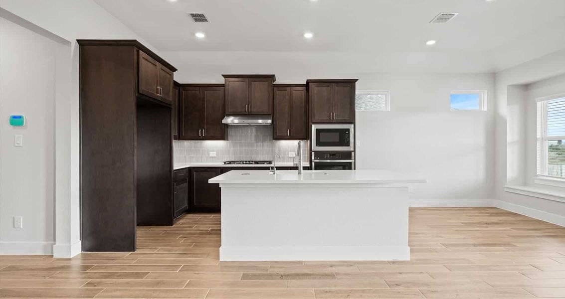 Representative furnished interior of a home built from the Aspen by Chesmar Homes in Village at Three Oaks, Seguin (Image 4).