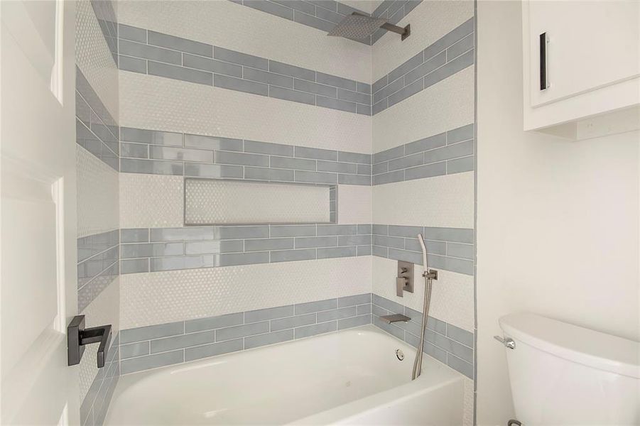 Bathroom with washtub / shower combination and toilet Bathroom with washtub / shower combination and toilet