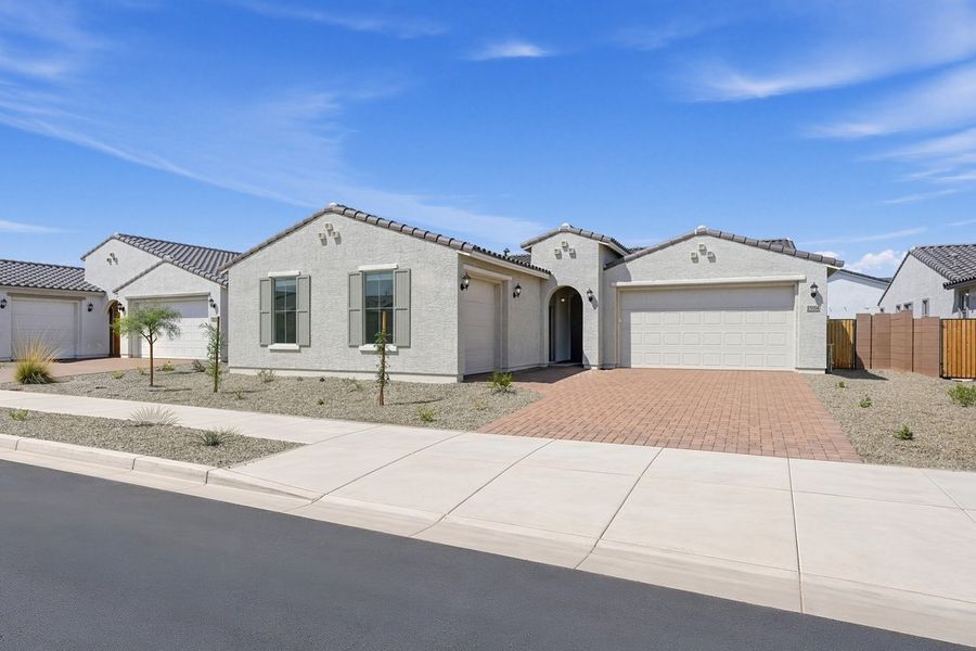 Front exterior of a new home in Artisan at Asante, Surprise, AZ, highlighting curb appeal (Image 16).