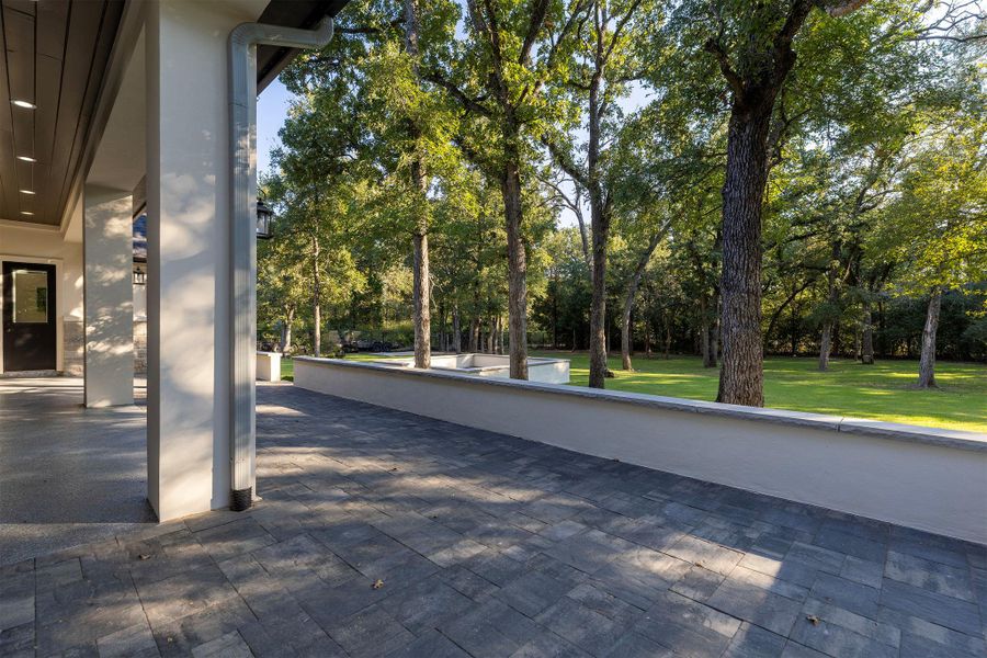 View of patio featuring view of scattered trees View of patio featuring view of scattered trees