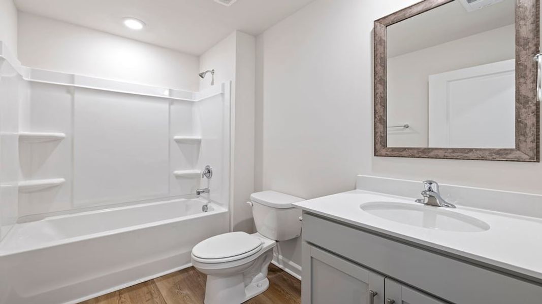 Furnished interior view inside a new home in Lakestone, Woodruff (Image 5).