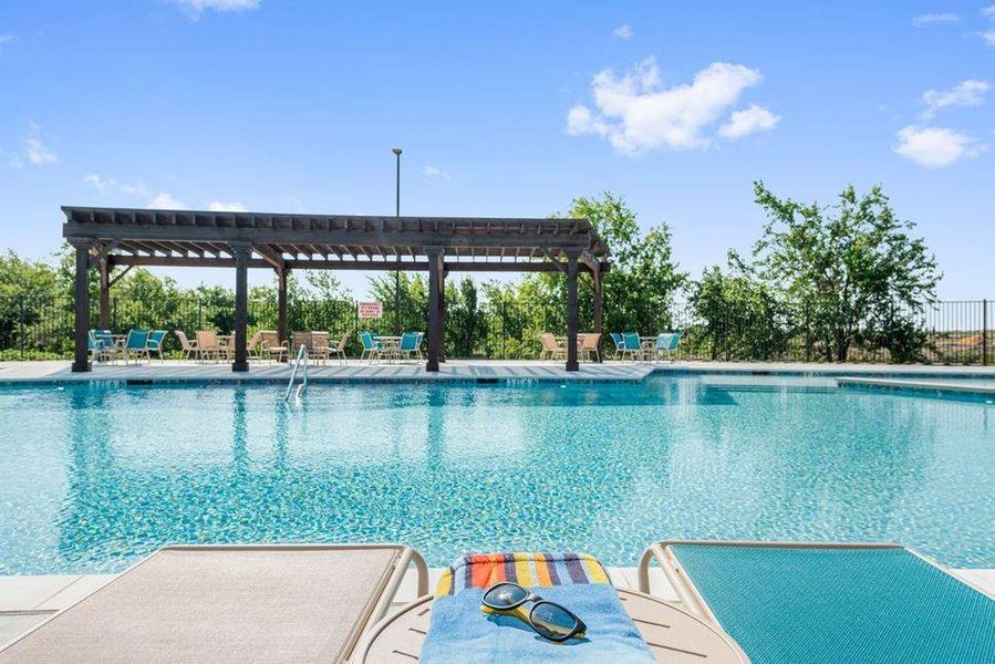 Outdoor swimming pool featuring a rectangular shape and light blue tile
