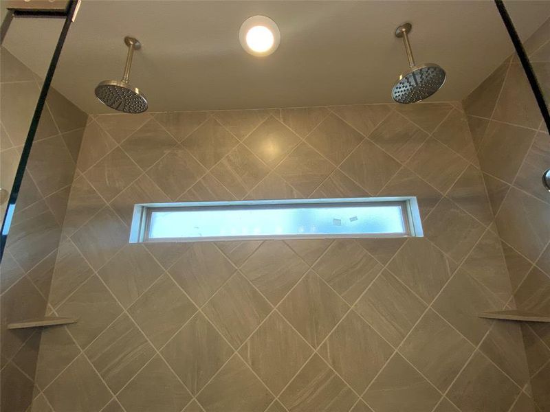 Close up of rain shower heads in master bathroom