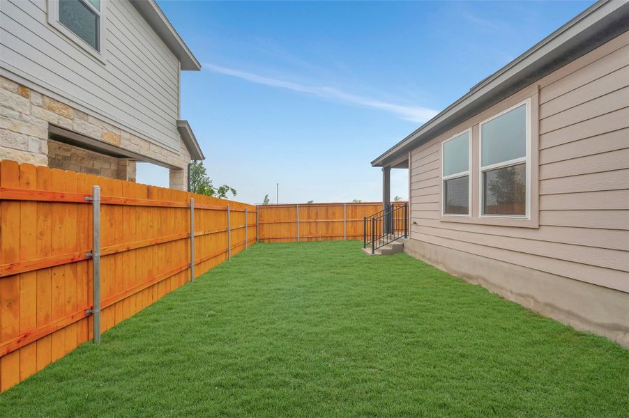 Exterior details and patio area of a home in Heritage, Dripping Springs (Image 3).