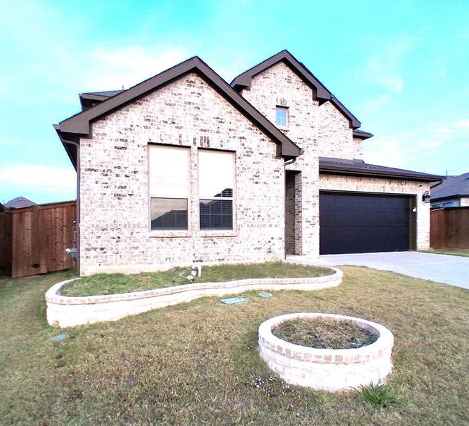 Front exterior of a new home in , Royse City, TX, highlighting curb appeal (Image 1).