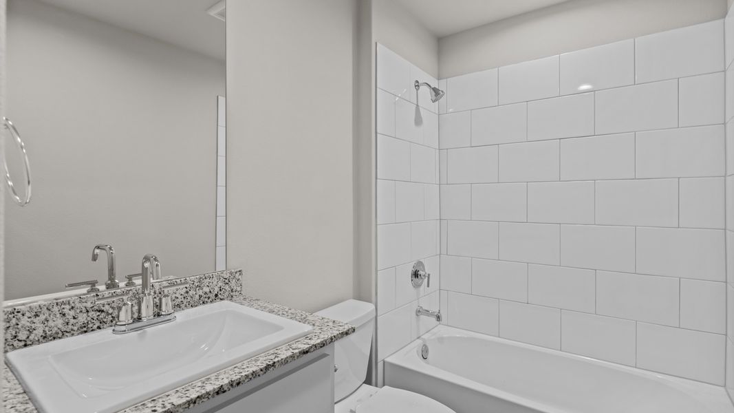 Representative furnished interior of a home built from the JUSTIN by D.R. Horton in Homestead at Parks Bell Ranch, Odessa (Image 18).