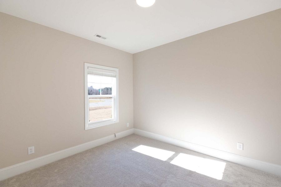 Representative unfurnished interior of a home built from the Carver by Caviness & Cates Communities in Maggie Way, Wendell (Image 141).