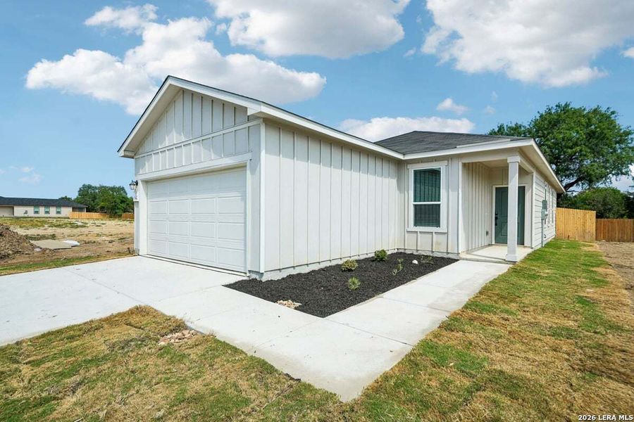 Front exterior of a new home in The Granary - Heritage Collection, San Antonio, TX, highlighting curb appeal (Image 17).