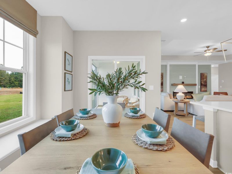 Dining room featuring ceiling fan, recessed lighting, and wood finished floors
