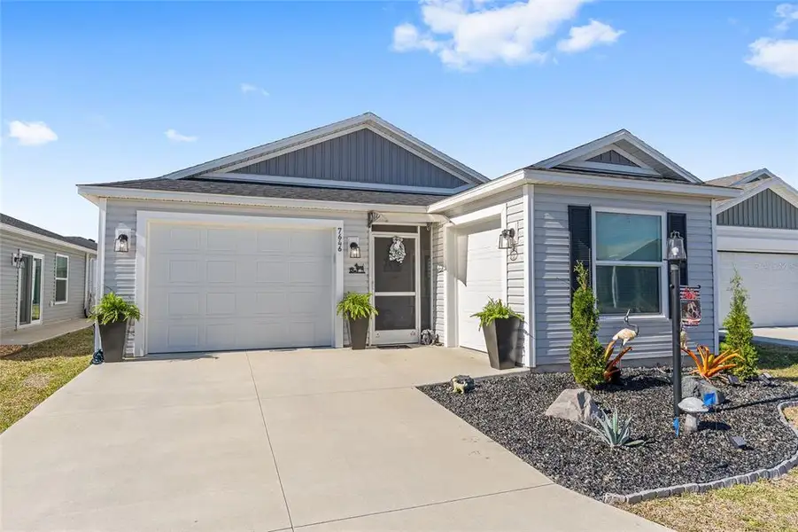 Front exterior of a new home in , The Villages, FL, highlighting curb appeal (Image 1). Front exterior of a new home in , The Villages, FL, highlighting curb appeal (Image 1).