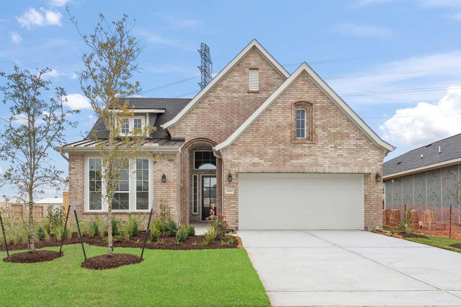 Front exterior of a new home in Mulberry Farms, Santa Fe, TX, highlighting curb appeal (Image 15). Front exterior of a new home in Mulberry Farms, Santa Fe, TX, highlighting curb appeal (Image 15).