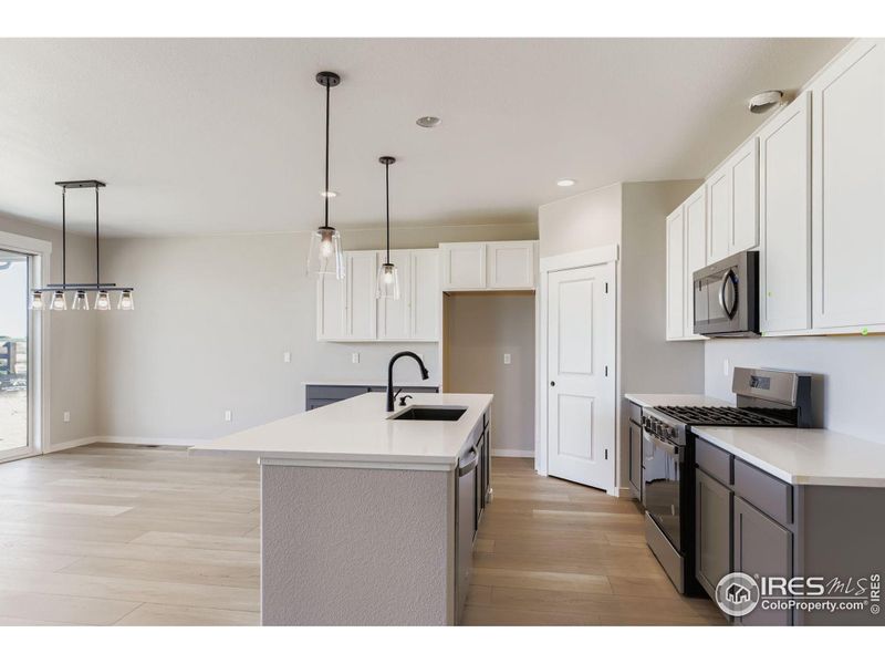 Furnished interior view inside a new home in Barefoot Lakes, Firestone (Image 12).