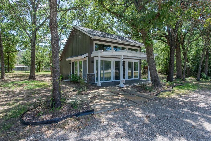 Exterior details and patio area of a home in , Log Cabin (Image 21).