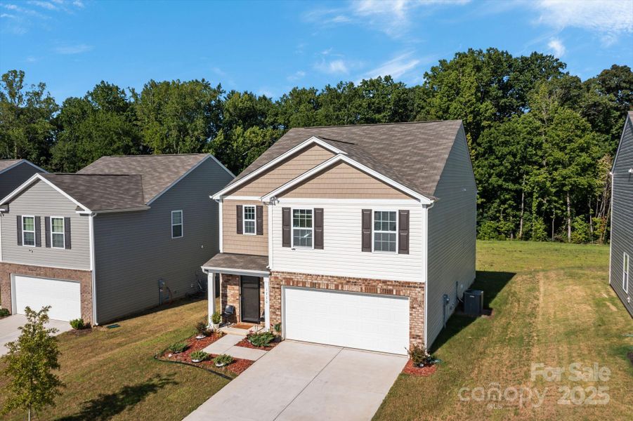 Front exterior of a new home in Mills at Long Creek, Dallas, NC, highlighting curb appeal (Image 22).