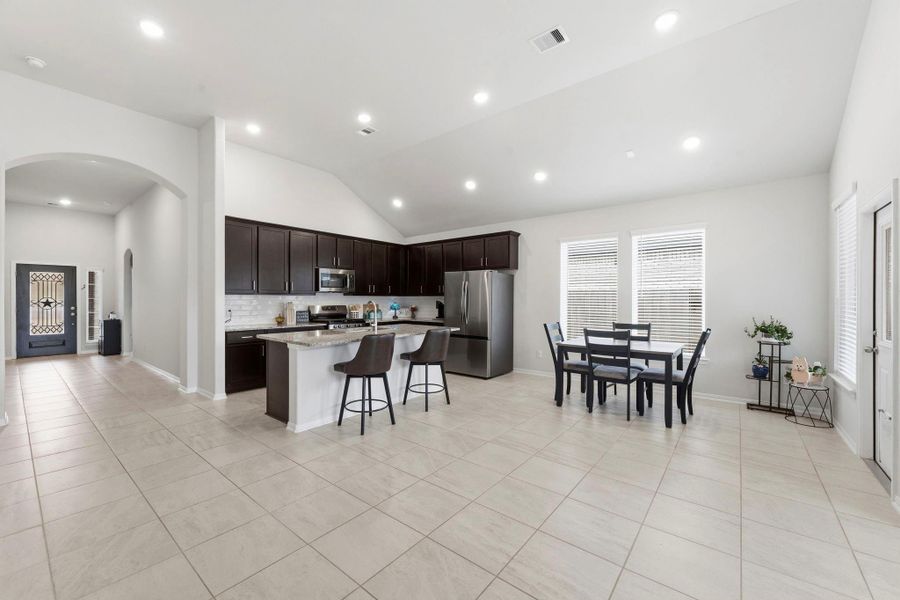 Open-concept living at its best with seamless flow from the living room to the kitchen and dining areas. Open-concept living at its best with seamless flow from the living room to the kitchen and dining areas.