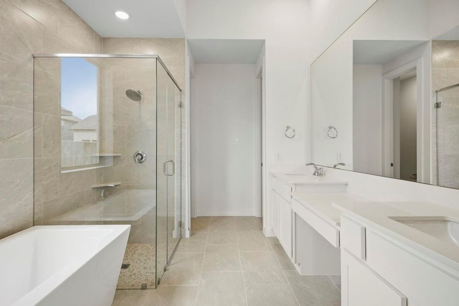 Primary Bathroom with separate tub and shower. Primary Bathroom with separate tub and shower.