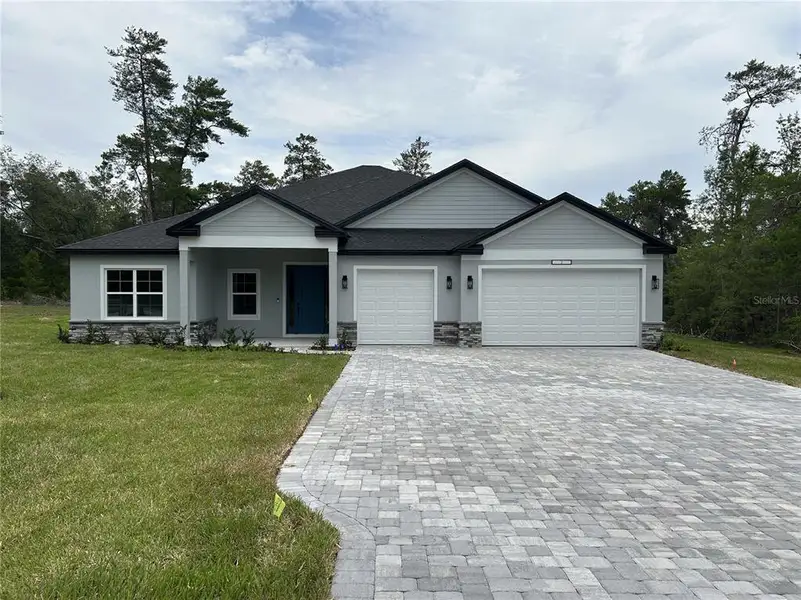 Front exterior of a new home in , Dunnellon, FL, highlighting curb appeal (Image 2). Front exterior of a new home in , Dunnellon, FL, highlighting curb appeal (Image 2).