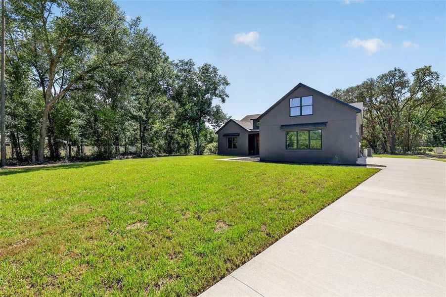 Front exterior of a new home in , Ocklawaha, FL, highlighting curb appeal (Image 27). Front exterior of a new home in , Ocklawaha, FL, highlighting curb appeal (Image 27).