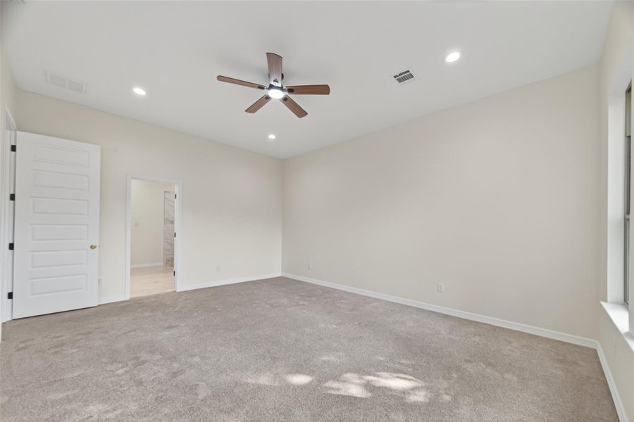 primary bedroom view towards primary bathroom.