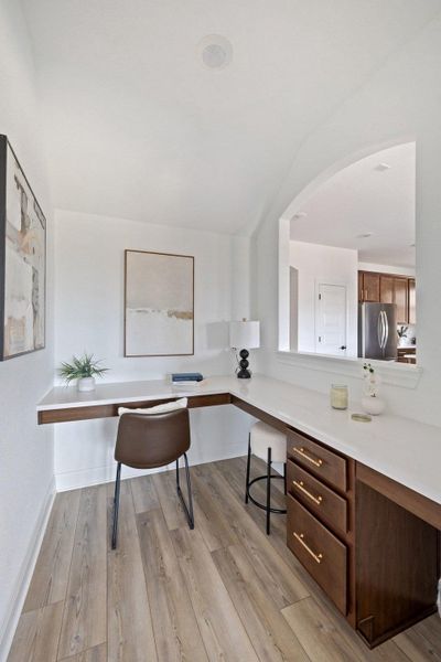 Home office with light wood finished floors and baseboards Home office with light wood finished floors and baseboards