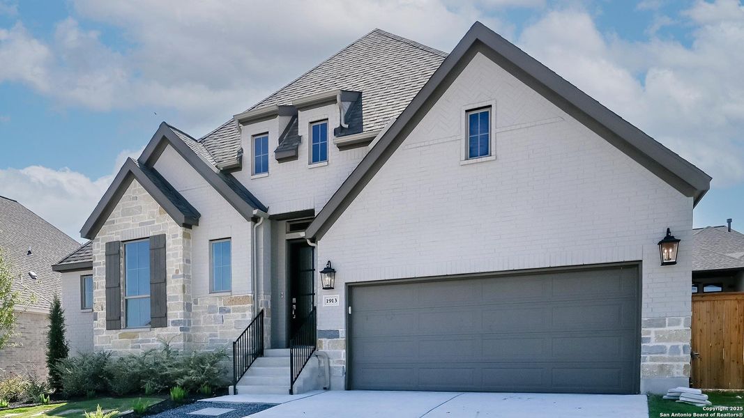 Front exterior of a new home in Veramendi 60', New Braunfels, TX, highlighting curb appeal (Image 25).