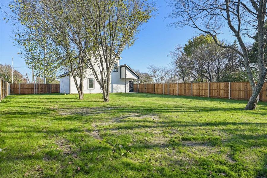 View of fenced backyard