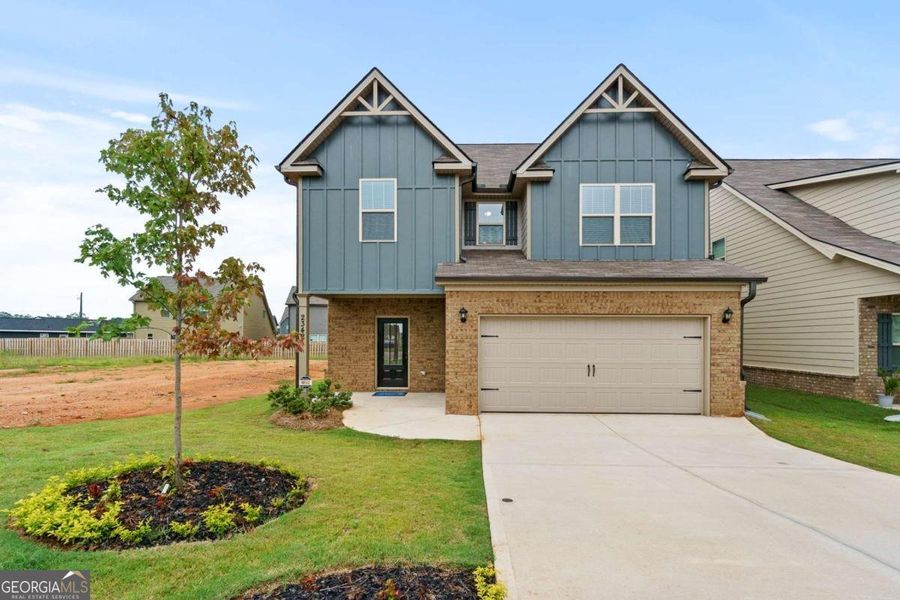 Front exterior of a new home in Walker Commons, Hampton, GA, highlighting curb appeal (Image 2).