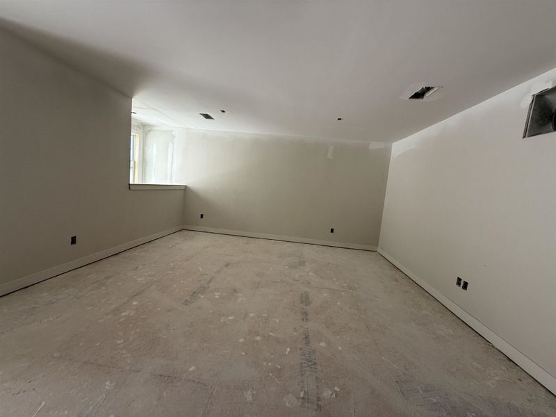 Empty room featuring baseboards