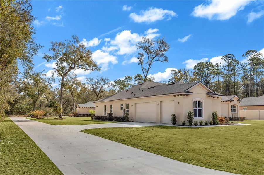 Front exterior of a new home in , Orange City, FL, highlighting curb appeal (Image 15).