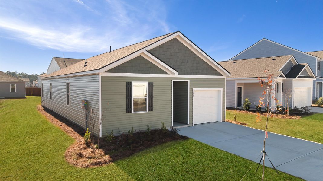 Front exterior of a new home in Pine Hills at Cane Bay, Moncks Corner, SC, highlighting curb appeal (Image 1). Front exterior of a new home in Pine Hills at Cane Bay, Moncks Corner, SC, highlighting curb appeal (Image 1).