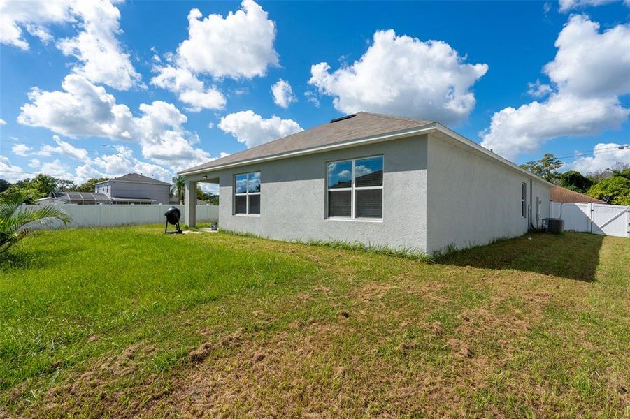 Exterior details and patio area of a home in Poinciana Enclave, Kissimmee (Image 2).