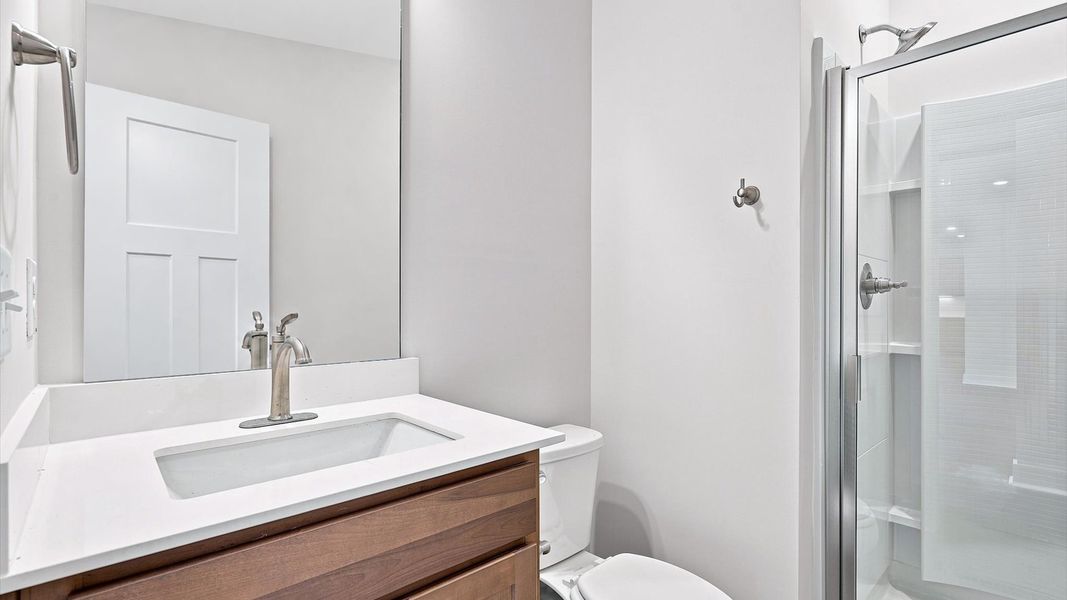 Elegant bath retreat with designer finishes and a clean, timeless aesthetic