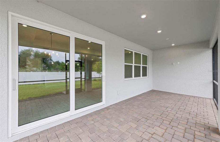 Exterior details and patio area of a home in Shores at Stillwater, Englewood (Image 25).