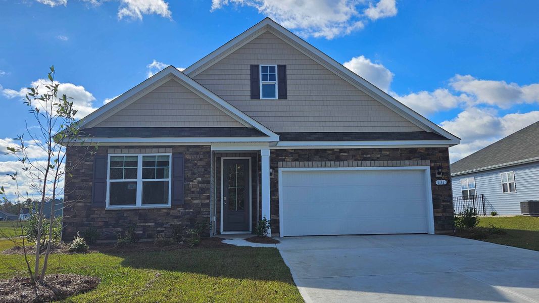 Front exterior of a new home in Lochaven, Conway, SC, highlighting curb appeal (Image 1). Front exterior of a new home in Lochaven, Conway, SC, highlighting curb appeal (Image 1).