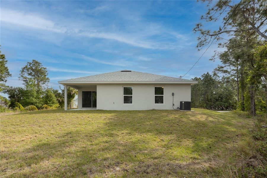 Front exterior of a new home in , Palm Bay, FL, highlighting curb appeal (Image 2).