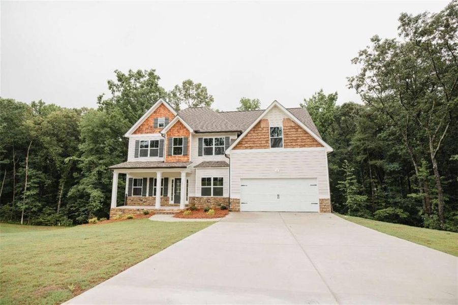 Front exterior of a new home in , Douglasville, GA, highlighting curb appeal (Image 2). Front exterior of a new home in , Douglasville, GA, highlighting curb appeal (Image 2).