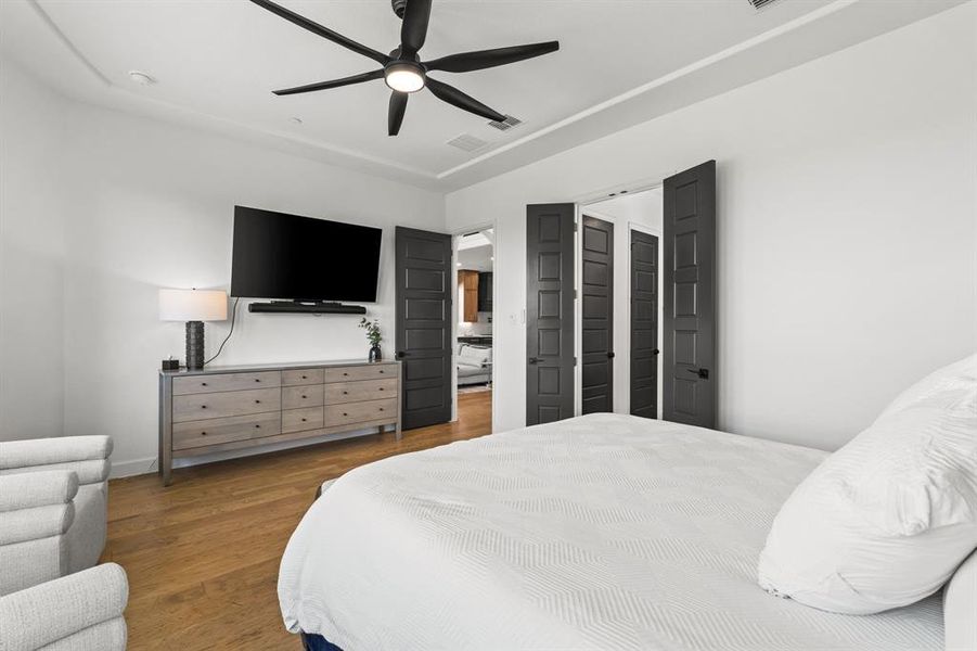 Bedroom featuring wood finished floors and ceiling fan Bedroom featuring wood finished floors and ceiling fan