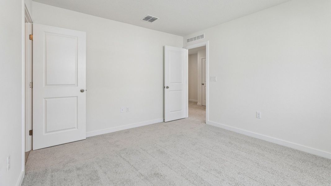 Furnished interior view inside a new home in Cyrene at Harmony, St. Cloud (Image 28).