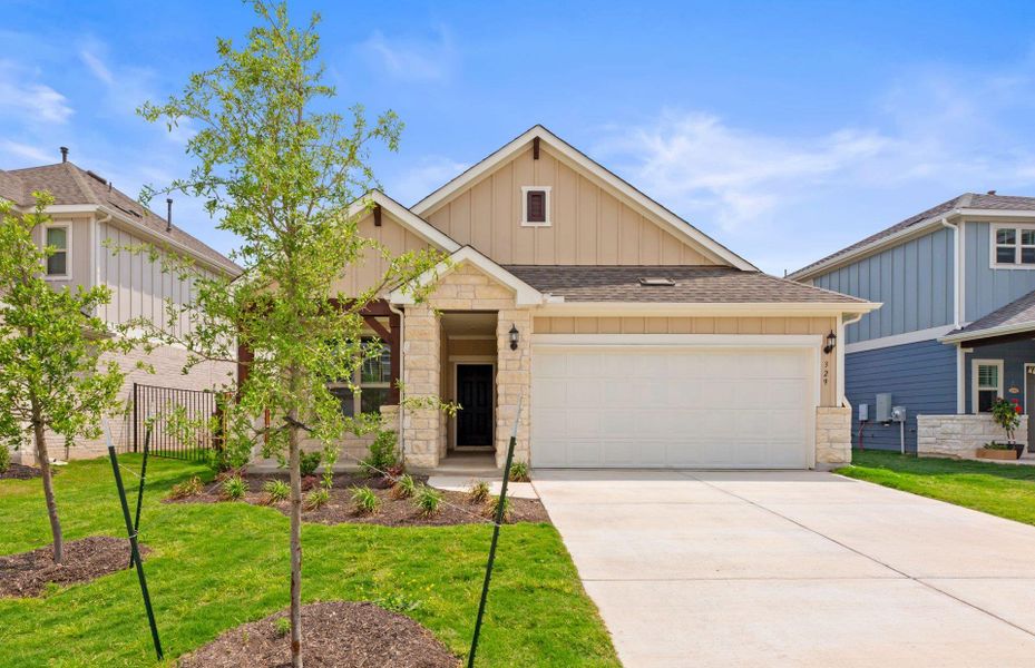 Front exterior of a new home in Santa Rita Ranch, Liberty Hill, TX, highlighting curb appeal (Image 20).