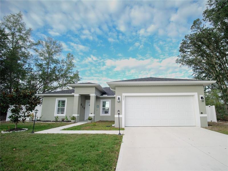 Front exterior of a new home in , Ocala, FL, highlighting curb appeal (Image 1). Front exterior of a new home in , Ocala, FL, highlighting curb appeal (Image 1).